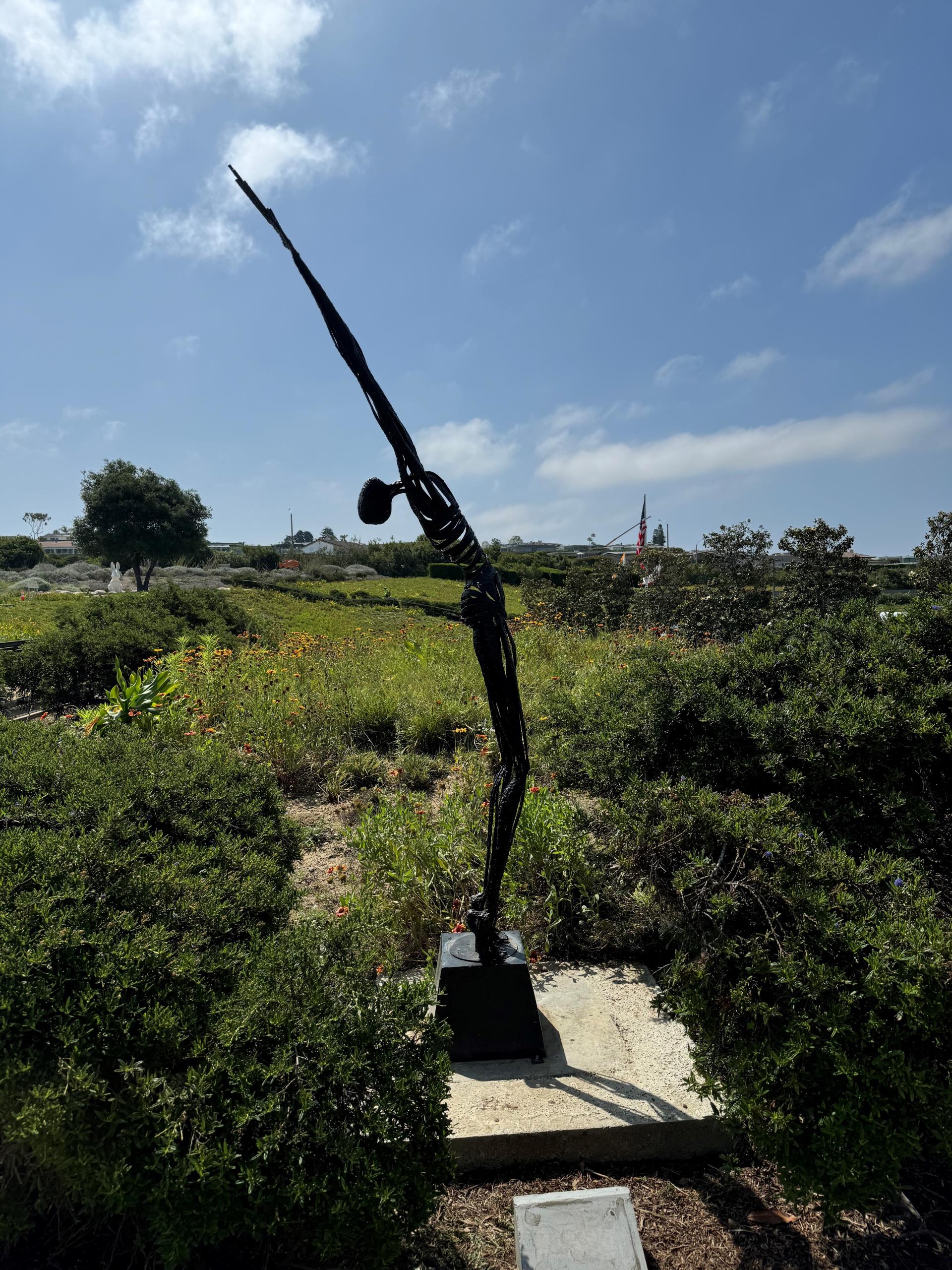 Sculpture of a man reaching towards the sky - sculpture in Civic Center Park