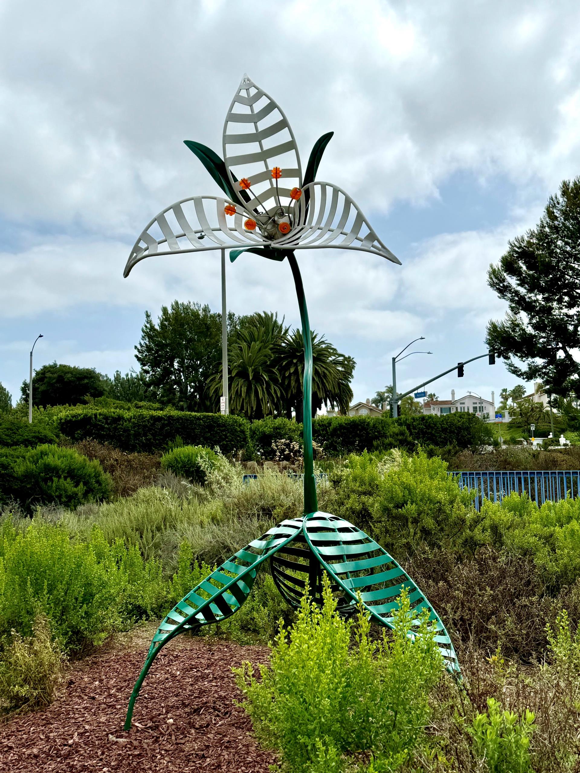 Sculpture of a flower with the leaves shaped for seating - sculpture in Civic Center Park