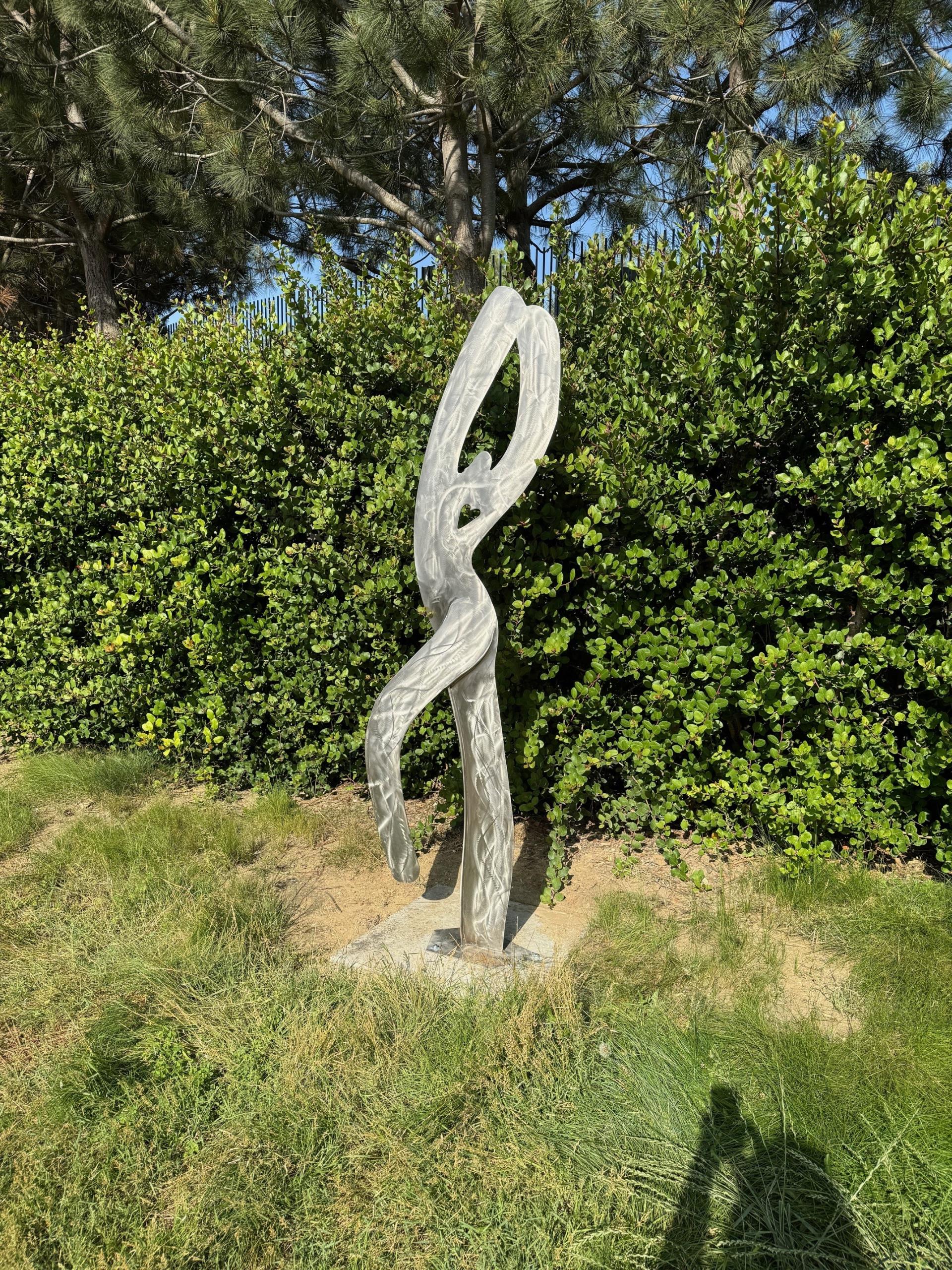 Sculpture of a figure in a playful stance - sculpture in Civic Center Park